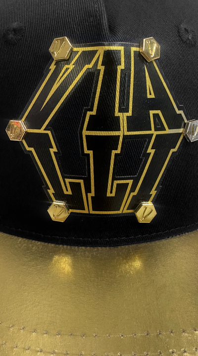 Vialli Golden Cap Black Gold Two-Tone Design with Hexagons and Snap Closure